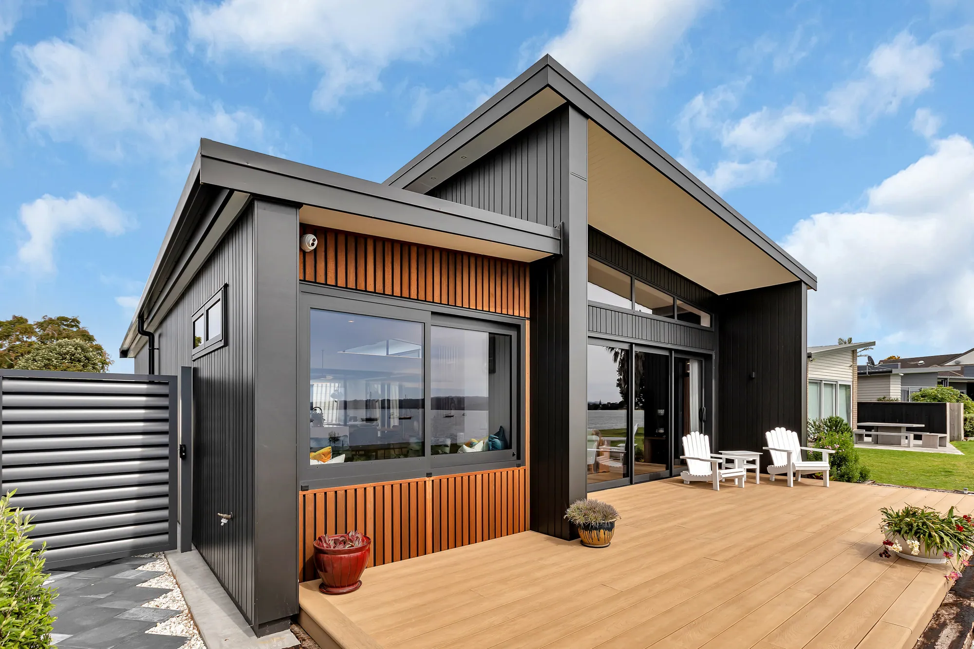 Cedar-clad custom home opening onto a north-facing deck