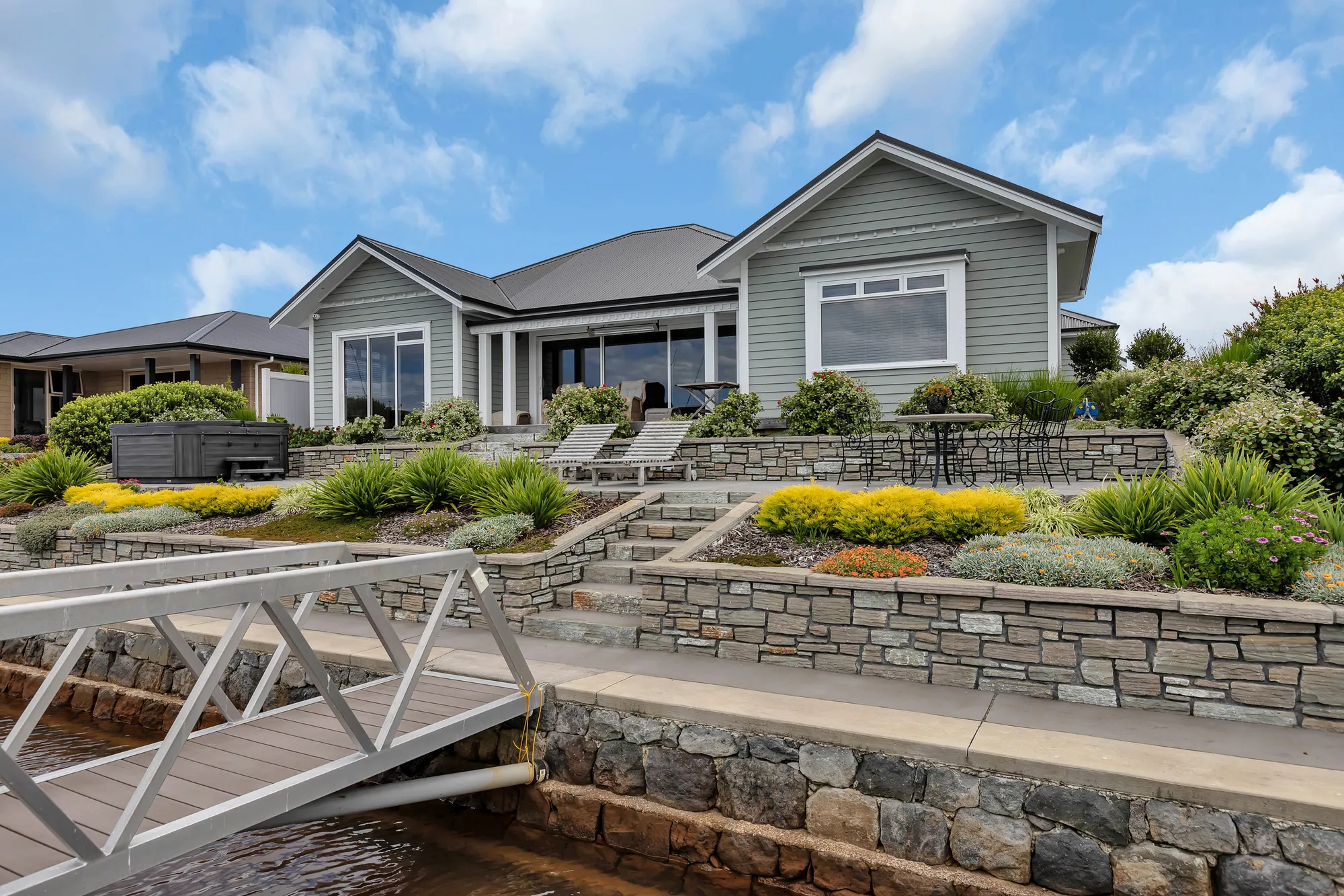 Canal frontage and private jetty at a Cogan home, Marsden Cove