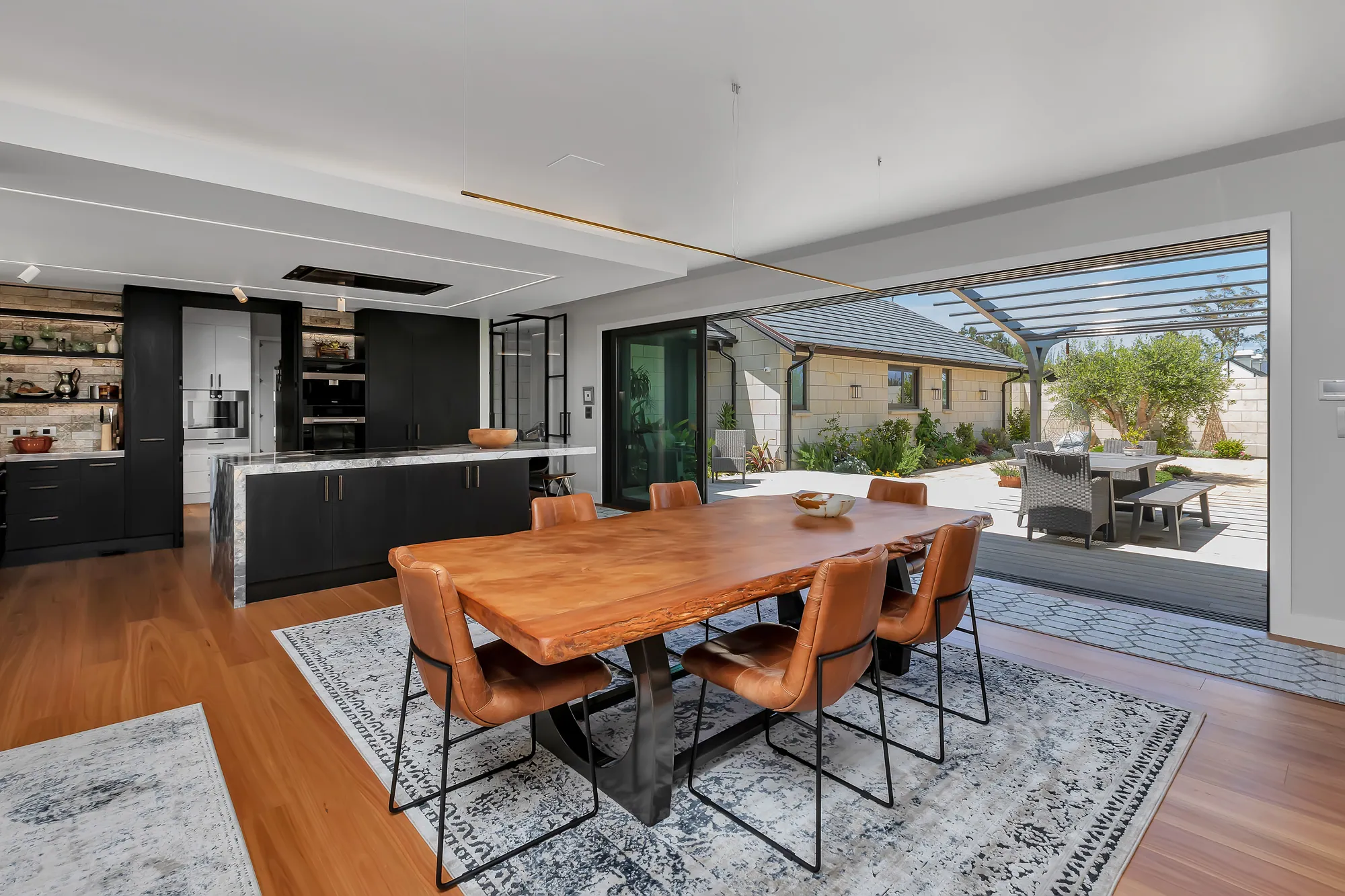 Dining room opening to the garden in a Waipu lifestyle home