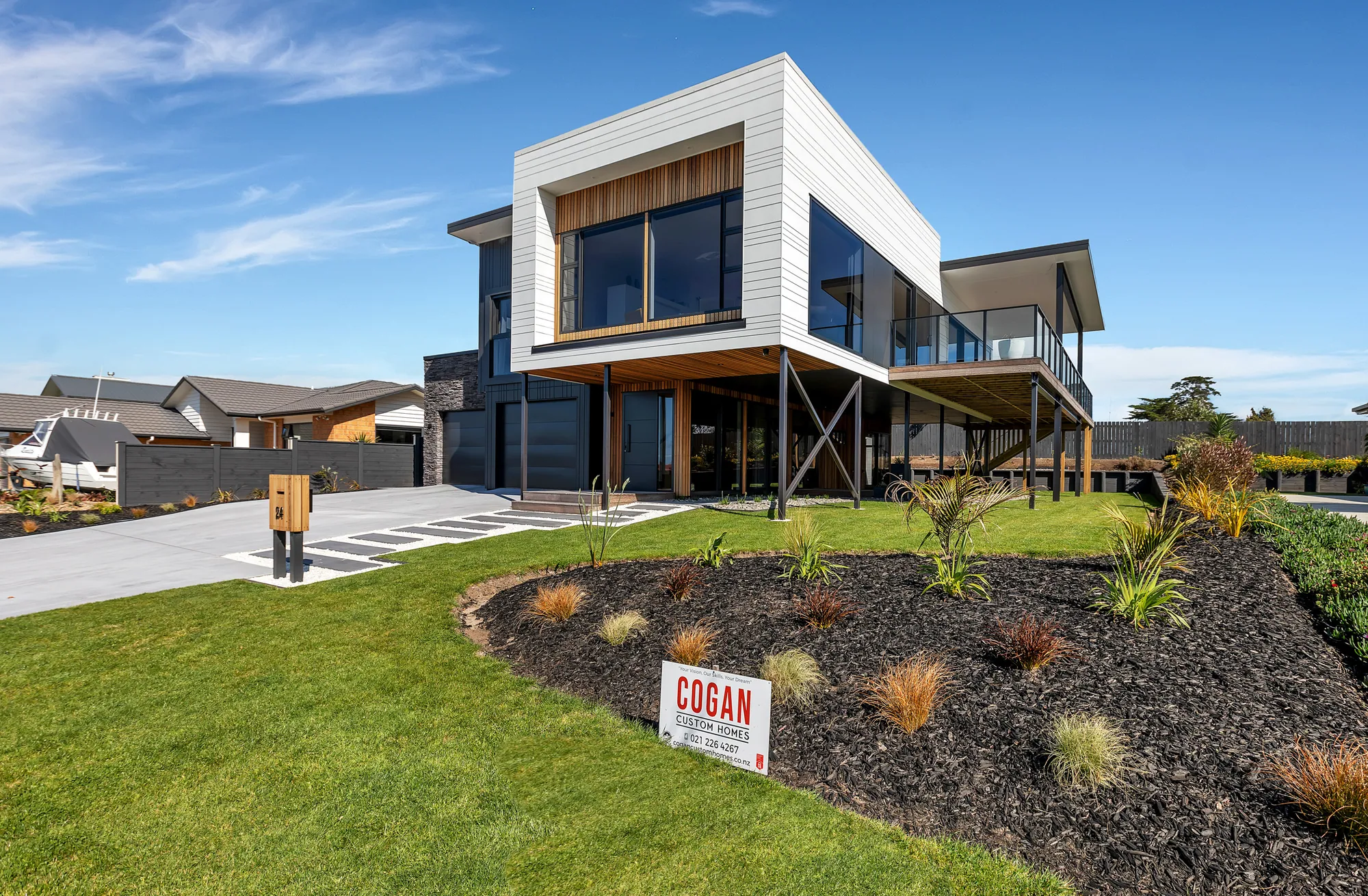 Contemporary Cogan home at Marsden Cove, cedar and dark cladding, seen from the street