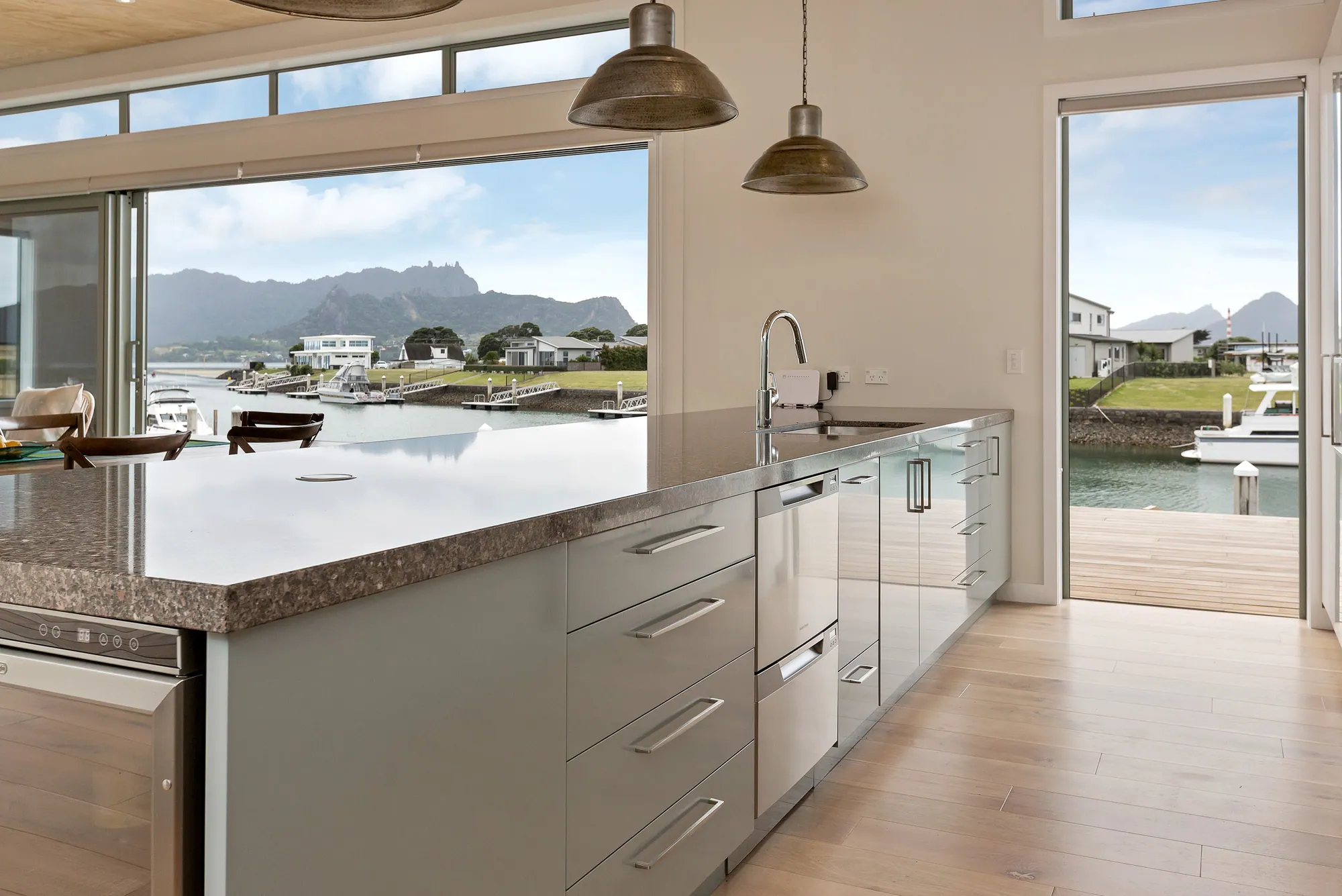 Kitchen bench looking out over the canal and moored boats