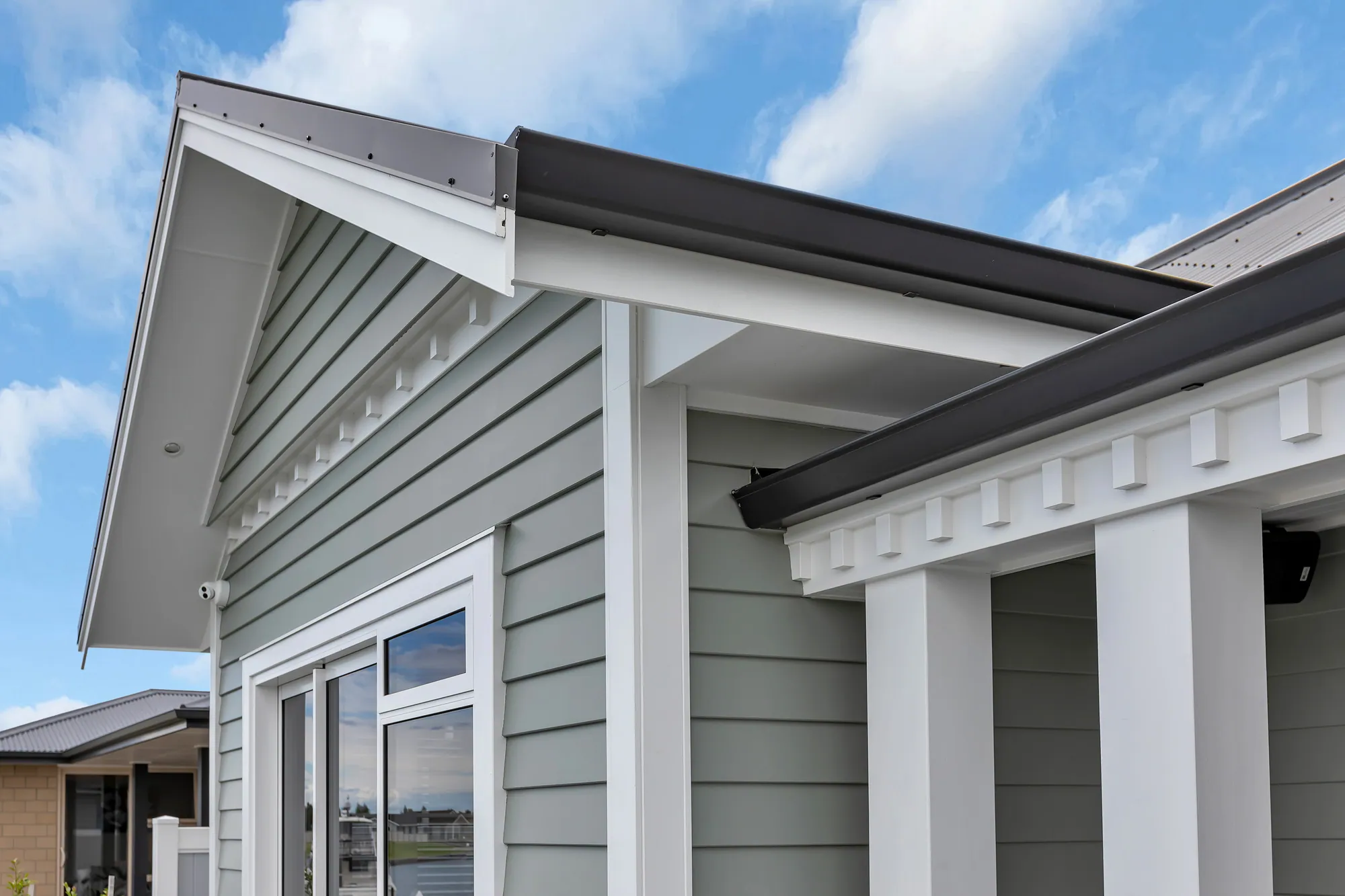 Gable and porch detailing on a weatherboard home