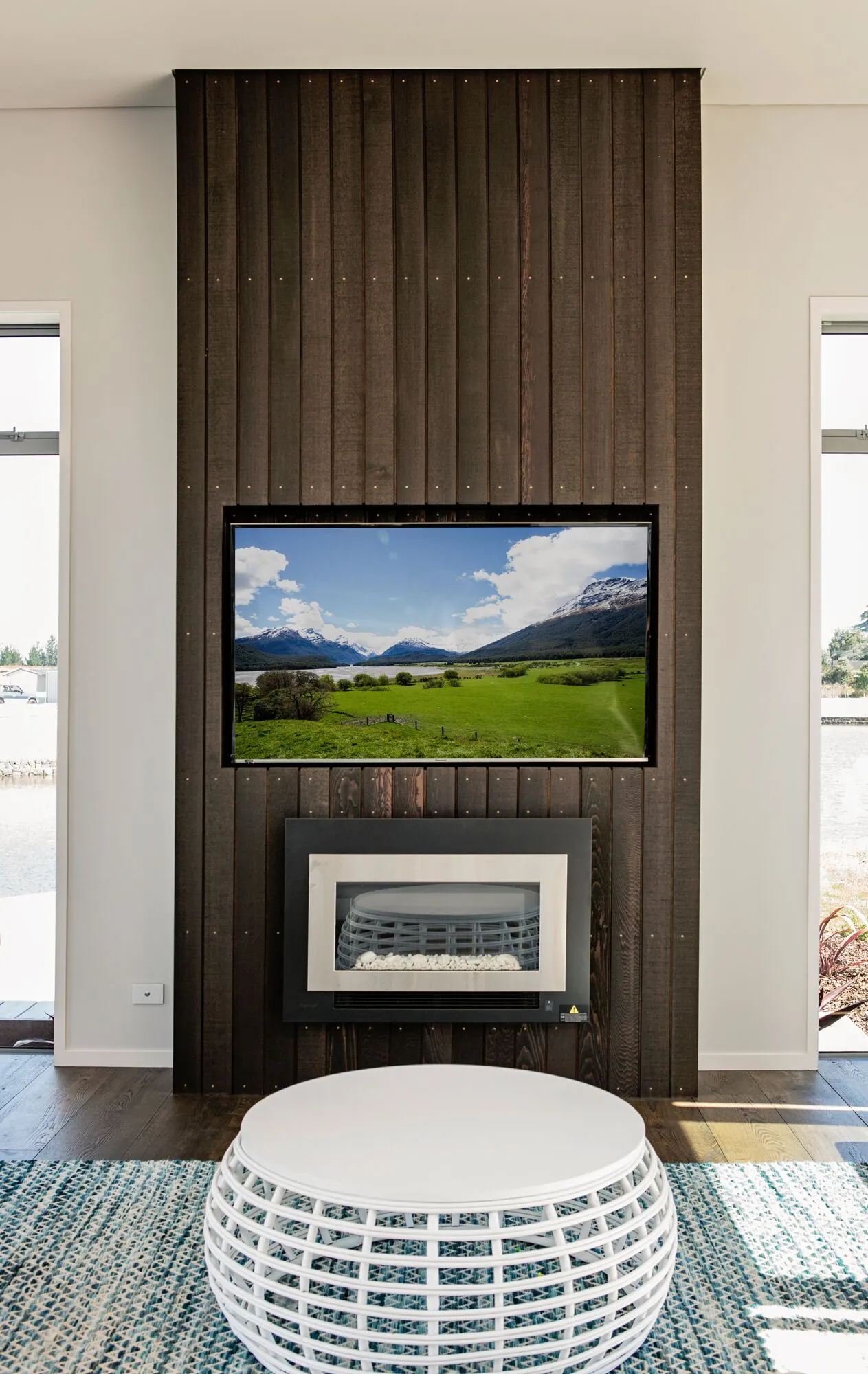 Fireplace wall with timber panelling