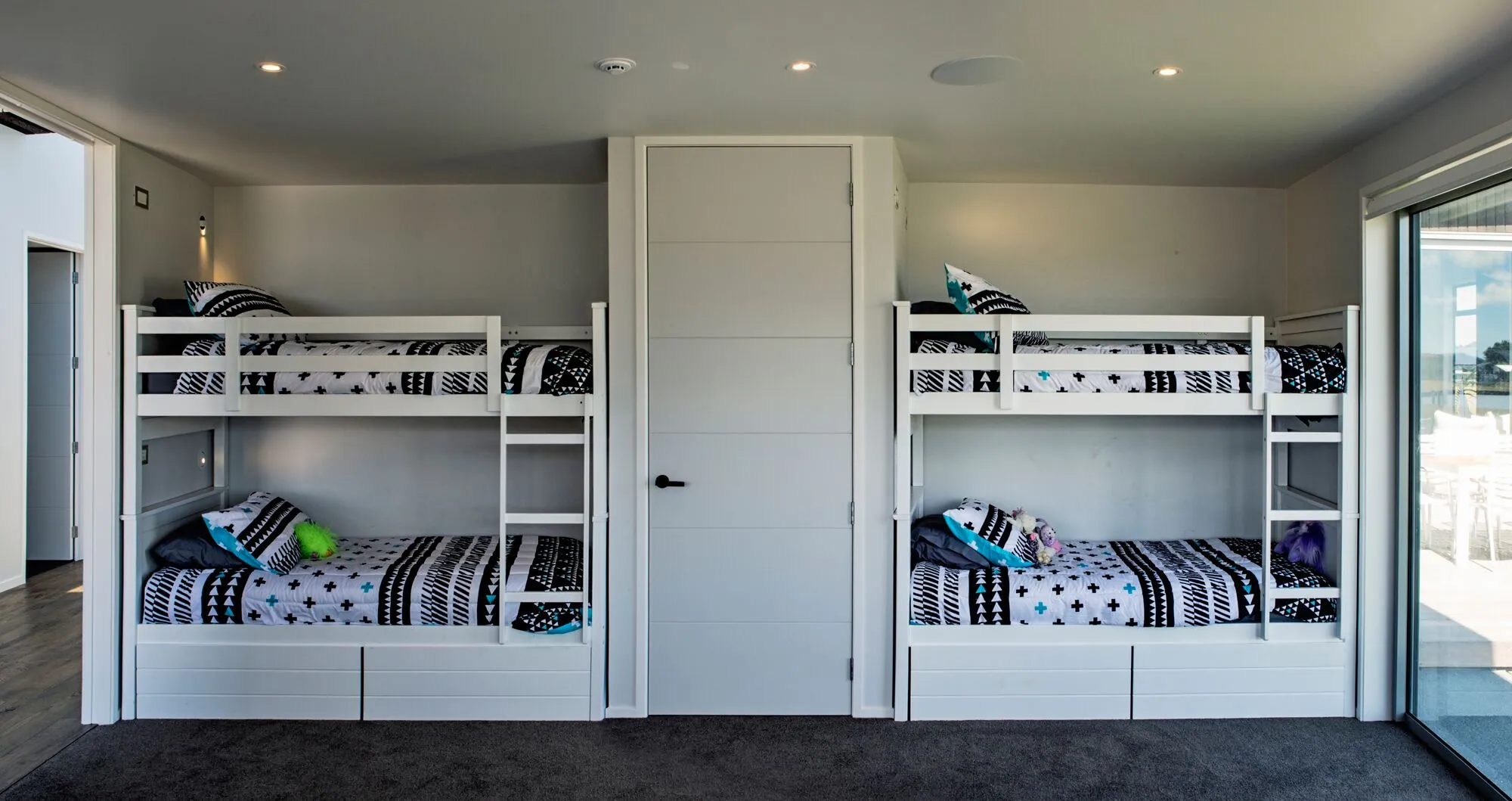 Bunk room with two sets of built-in bunks