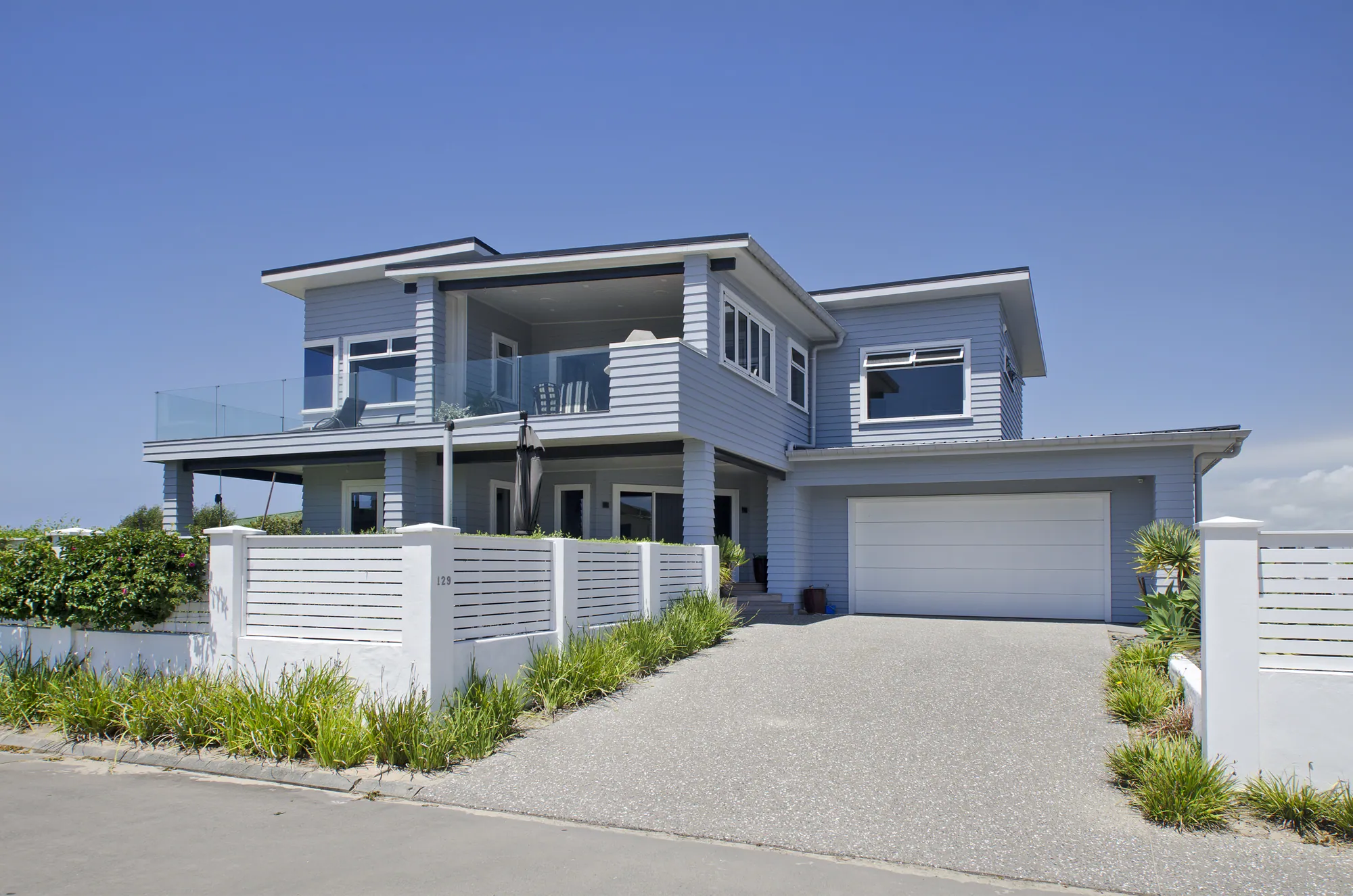 Two-storey reclad home with balconies and a garage