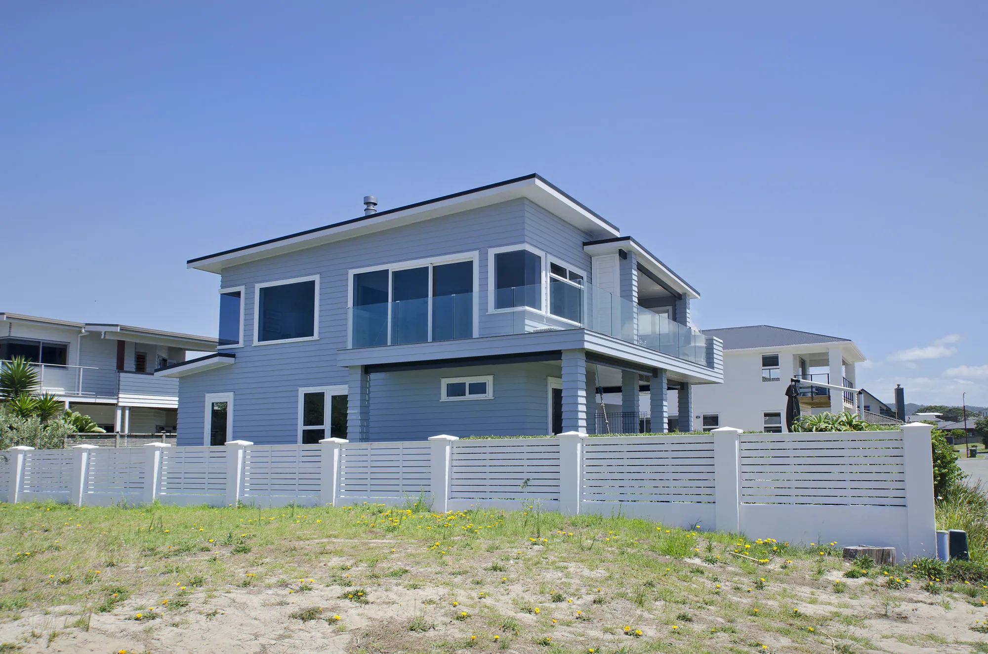 Reclad two-storey home above the dunes