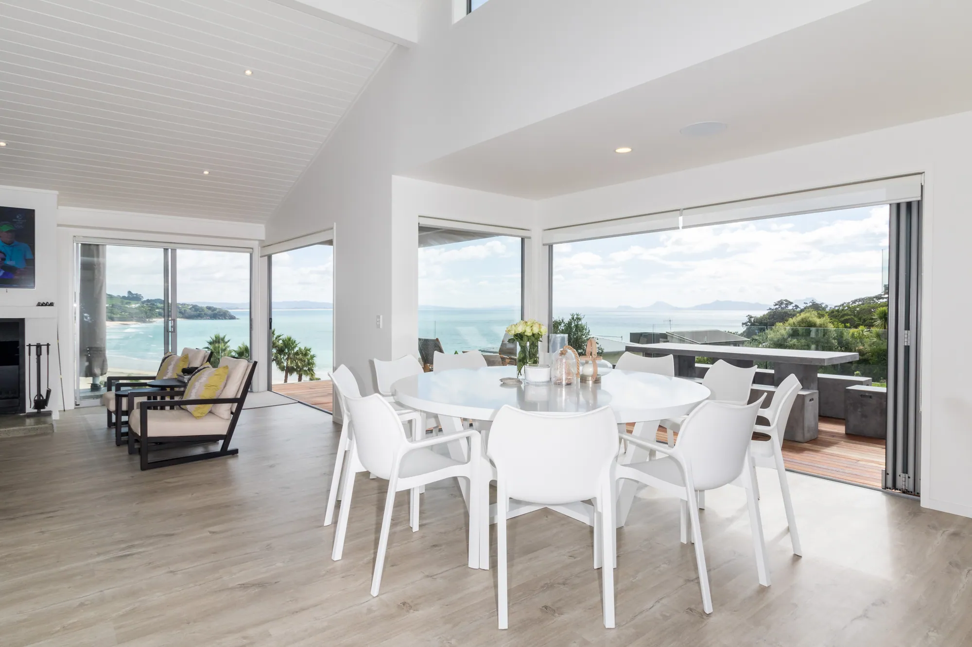Kitchen and dining opening to the sea in a renovated beach house