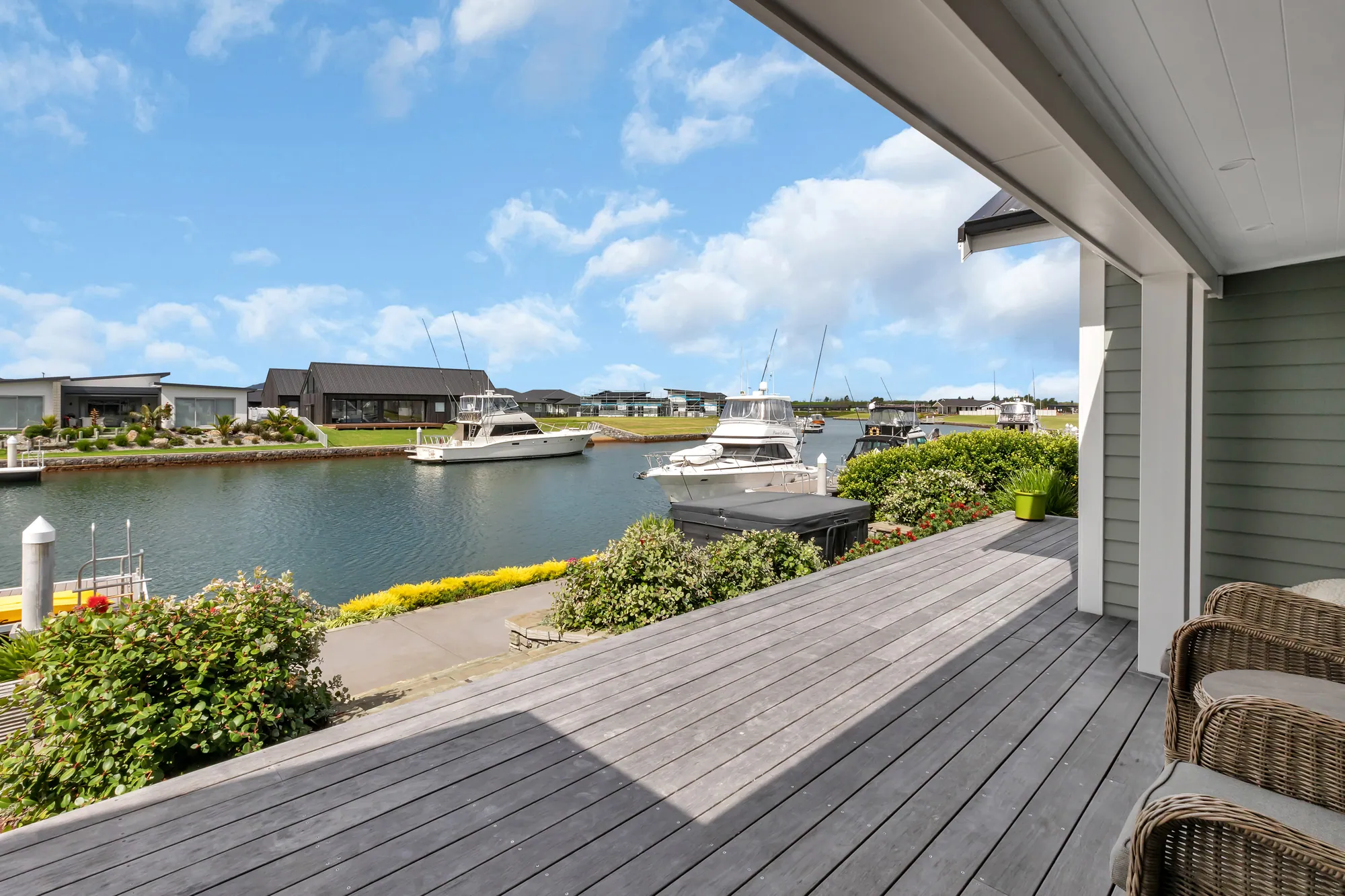 Deck looking over the canal to moored boats