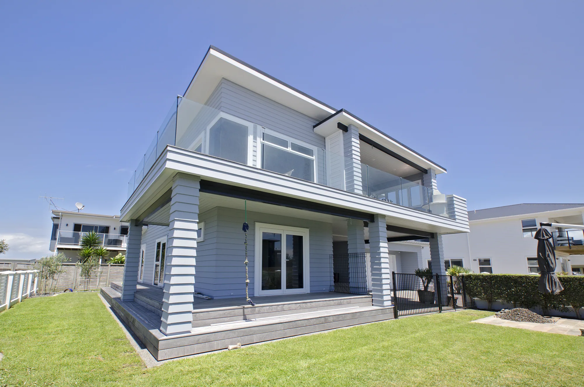 Seaward elevation of a recladded beach house, Ruakaka Beach