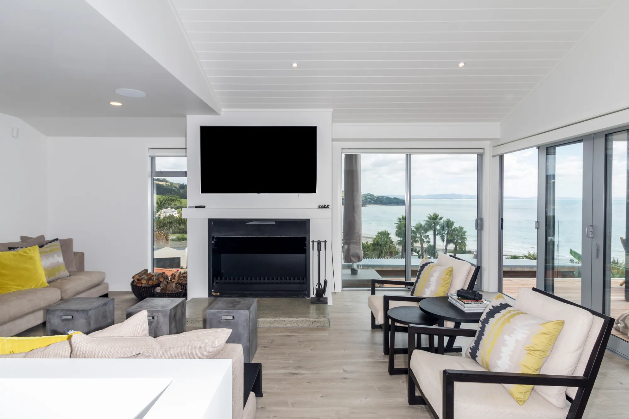 Renovated living room and fireplace opening to the sea, Langs Beach