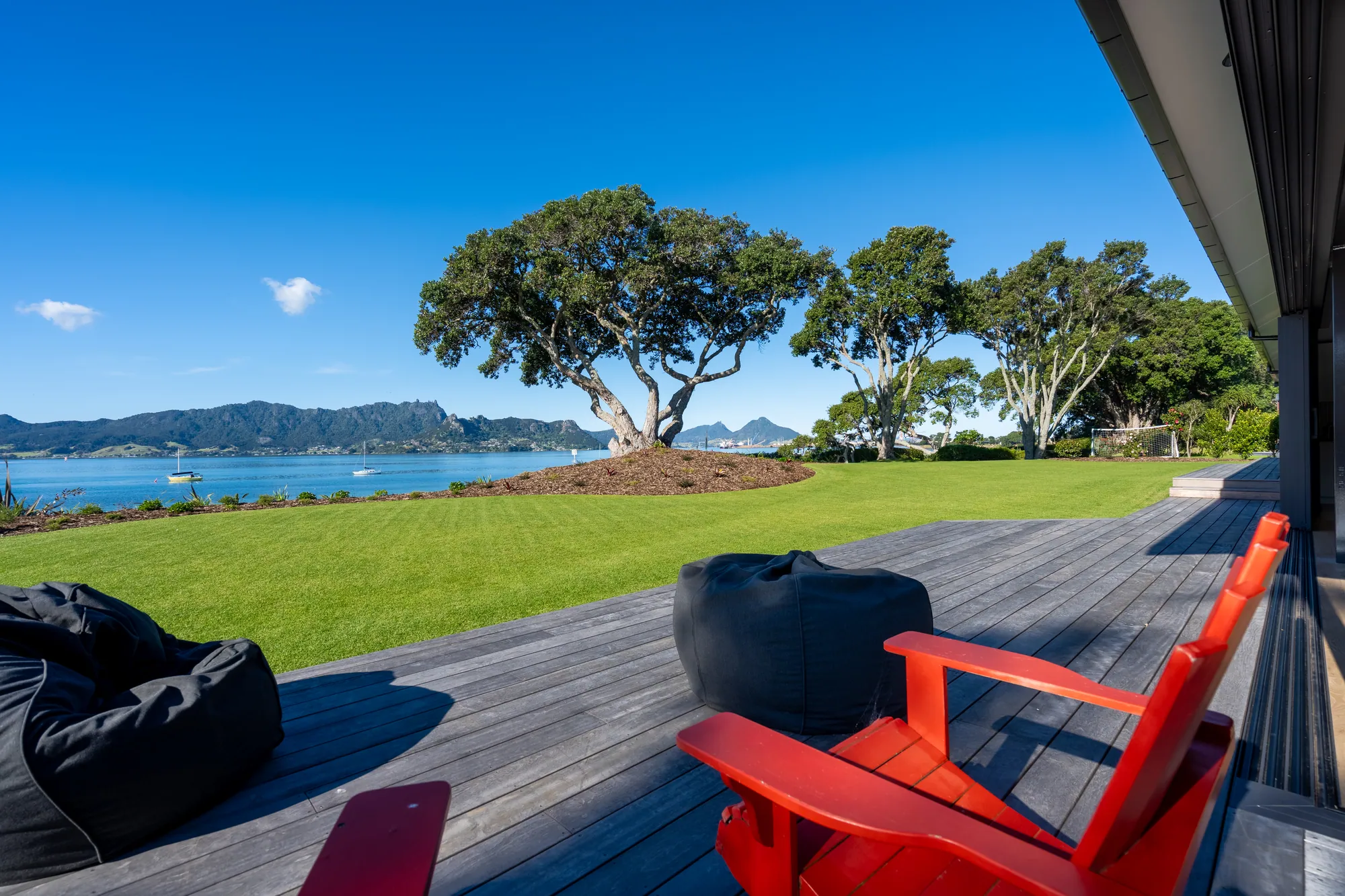 The showhome deck looking over the lawn to the water